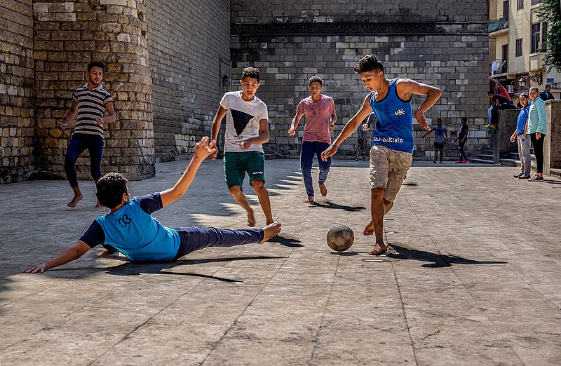 800px-Boys_playing_street_football_in_Egypt